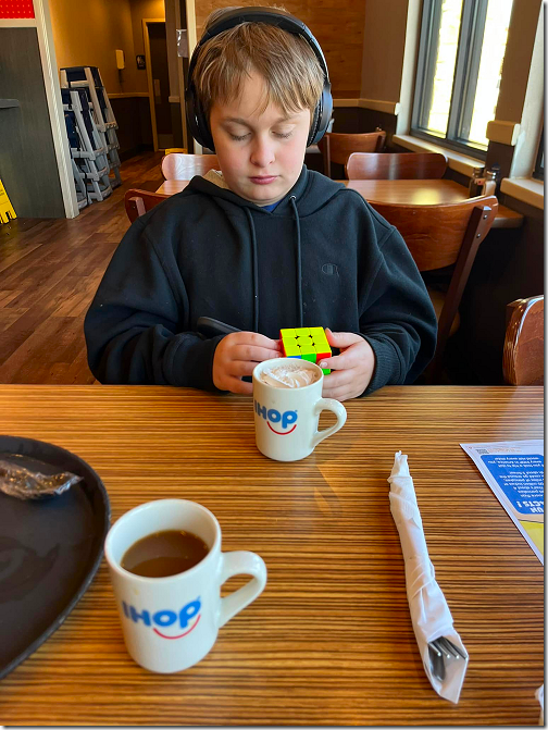 Landon at IHOP with Rubik's Cube